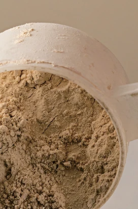 Supplement powder and a measuring scoop